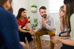 substance abuse treatment program clients meet for a group therapy session